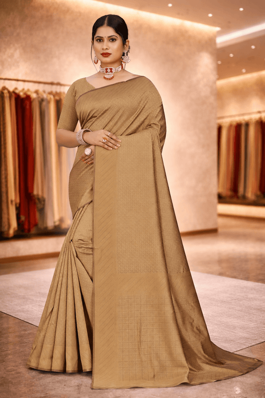 Full-length front pose showcasing the elegant drape and sheen of the antique gold minimalist saree