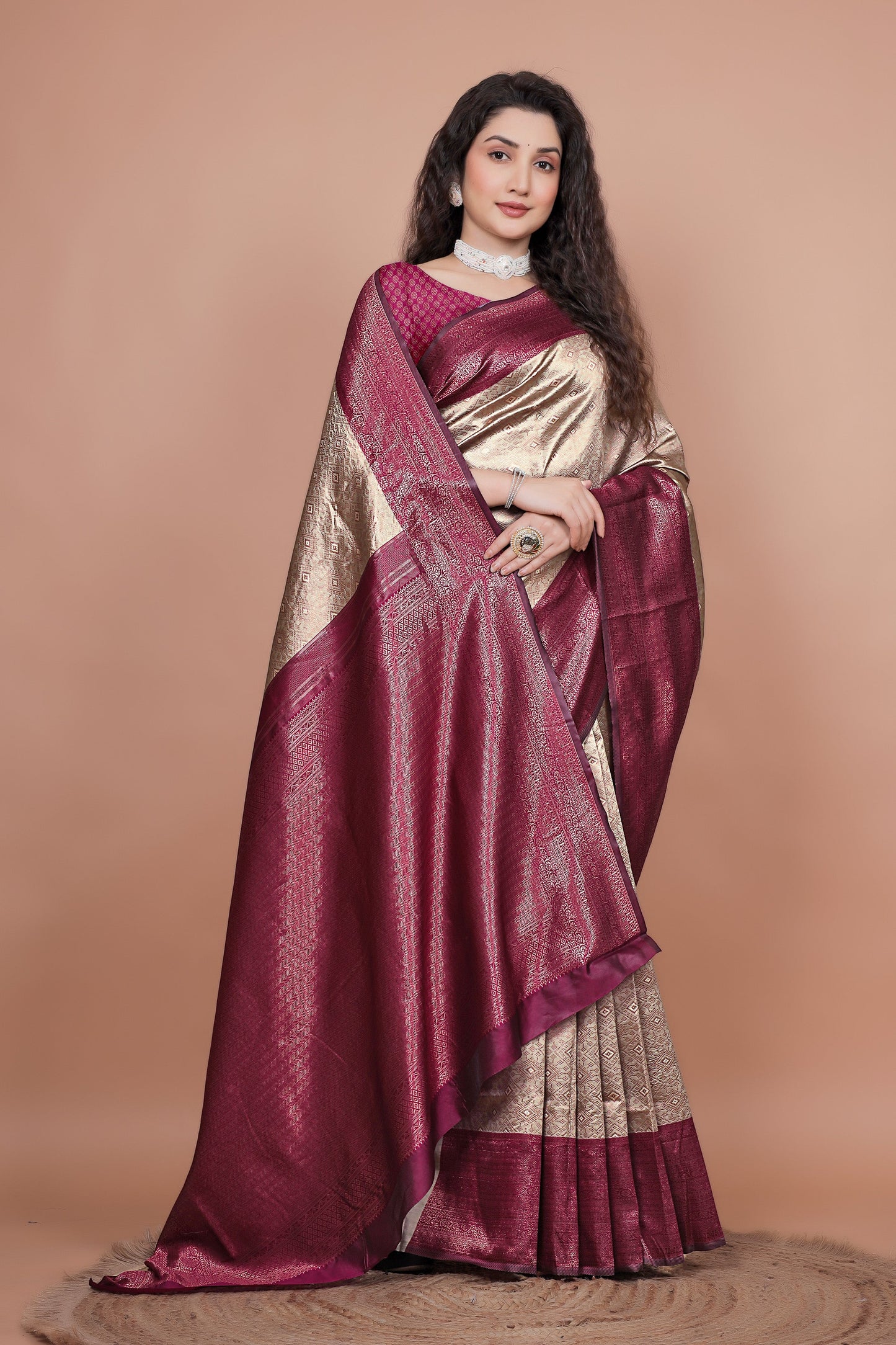 Close up of the heavy zari woven cherry pallu on a traditional silk saree