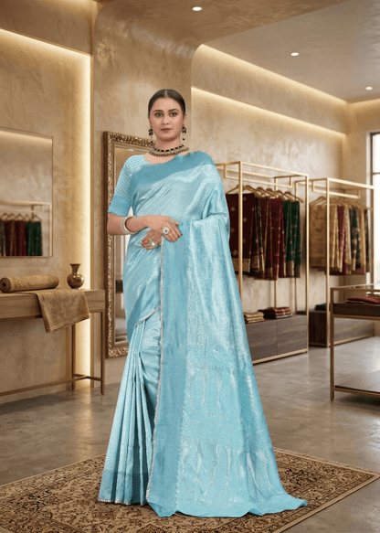 Full front pose of a model standing gracefully in a firozi sky blue jacquard traditional saree