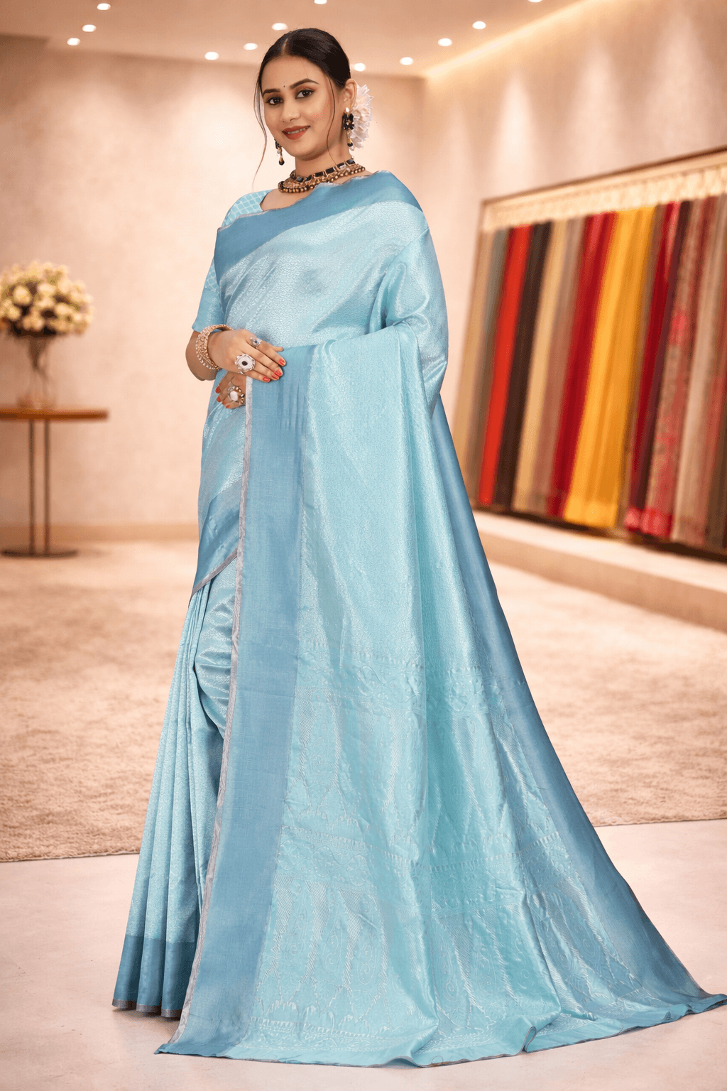 Elegant side drape showcasing the beautiful woven pallu and subtle sheen of the firozi blue saree