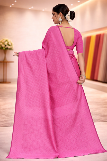 Back view of the model showcasing the drape and matching blouse of the plain pink ethnic saree