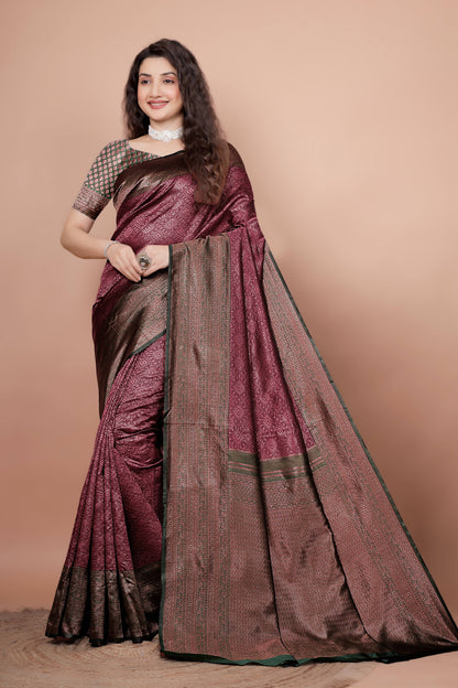 Woman modeling a beautiful maroon and green woven silk saree