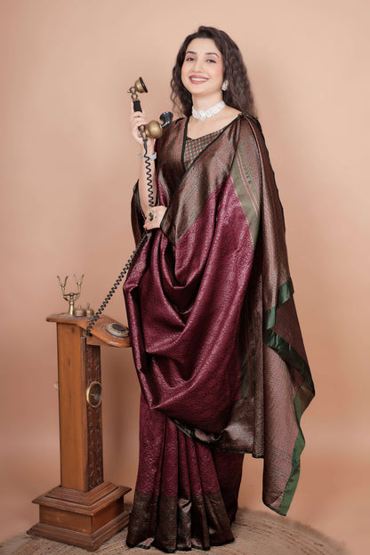 Elegant maroon silk saree with heavy zari pallu and vintage telephone