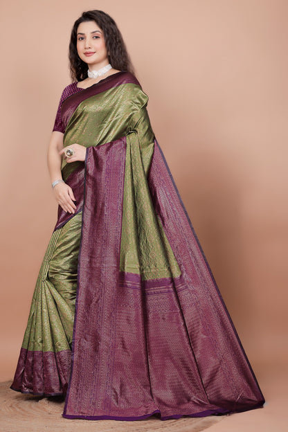 Side angle showcasing the rich cherry pallu and mehndi green pleats