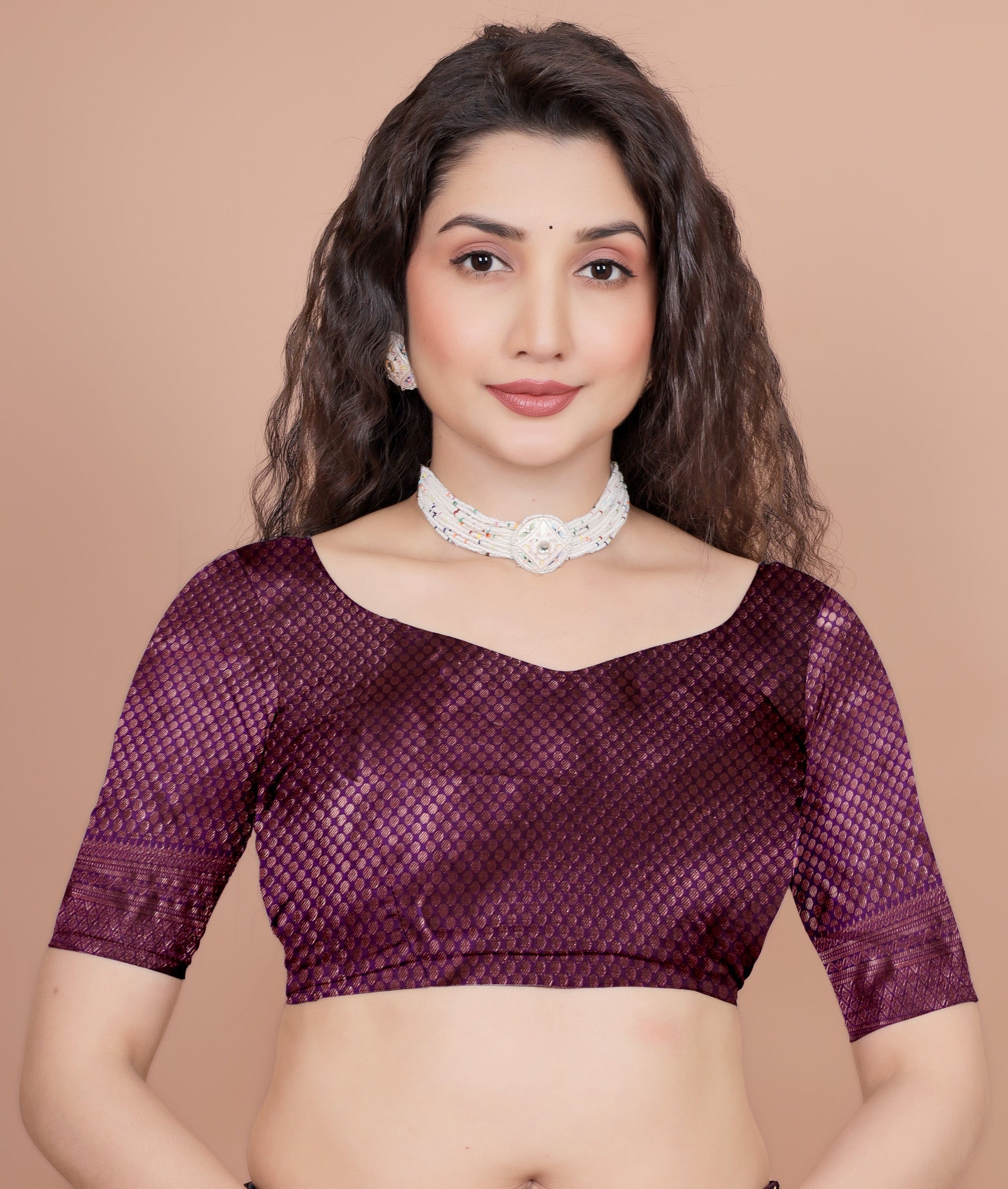 Front close up of unstitched cherry color blouse piece for silk saree