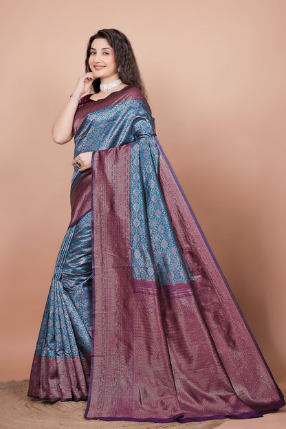 Side angle showcasing the rich wine pallu and peacock blue pleats