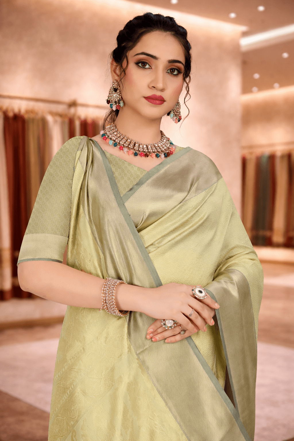 Close-up portrait of a woman wearing a fresh pista green ethnic saree with jewelry