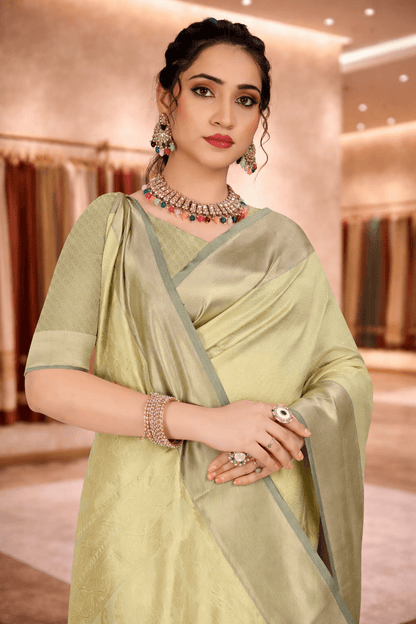 Close-up portrait of a woman wearing a fresh pista green ethnic saree with jewelry