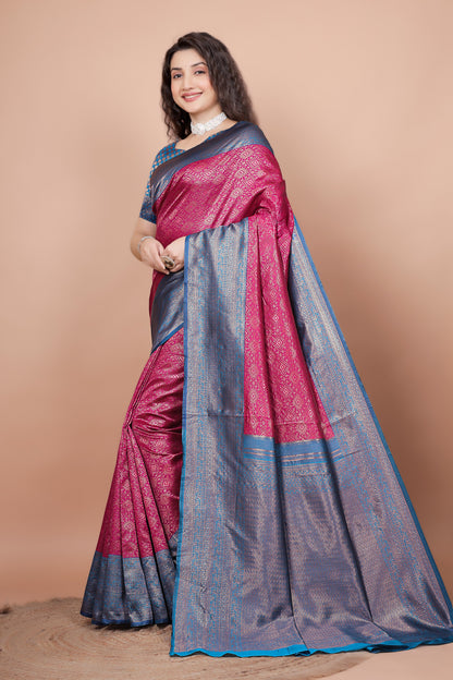 Side view of the rani pink saree displaying the detailed peacock blue pallu and pleats