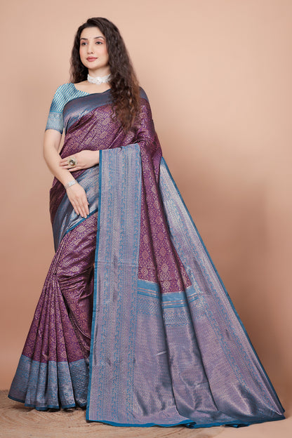 Full front view of a woman wearing a deep wine and peacock blue woven silk saree