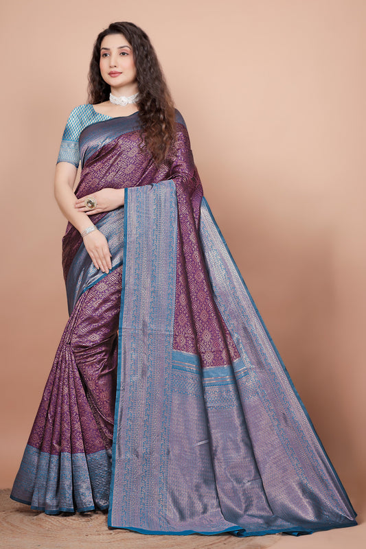 Full front view of a woman wearing a deep wine and peacock blue woven silk saree